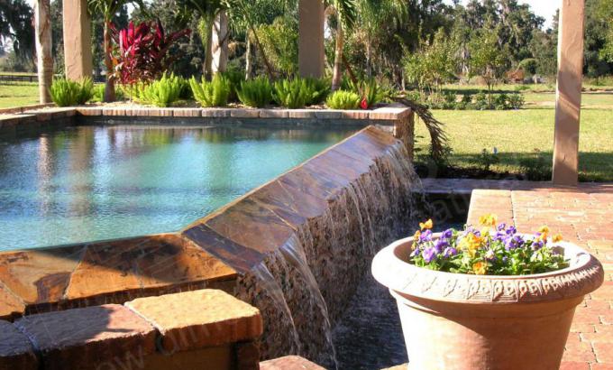 Natural Stacked Stone Veneer Waterfall in a pool